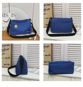 Bolso bandolera de nailon azul vistas detalladas del frente parte trasera y base