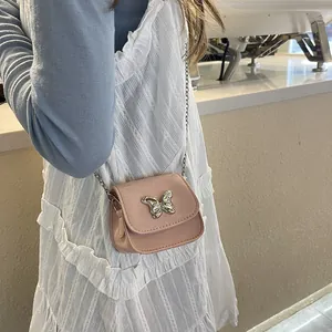 Pink mini crossbody bag with silver butterfly clasp and metal chain strap for women