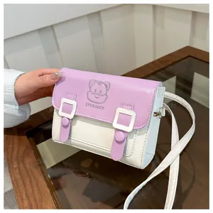 Close-up of purple and white PU leather crossbody bag with cartoon bear design