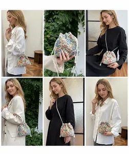 Detail view of floral drawstring bucket bag showing diverse carrying styles on models