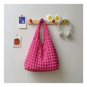 Detail of vibrant pink bubble texture fabric on this stylish popcorn shoulder bag