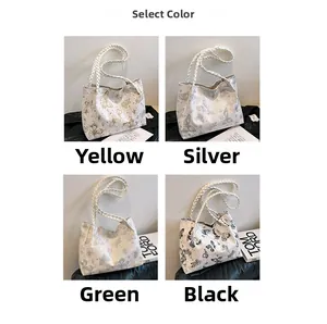 Tote bags with butterfly prints and rope handles in yellow, silver, green, and black colors