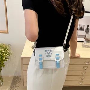 Cute white and blue PU crossbody bag with cartoon cat embroidery and stylish buckles