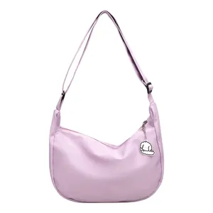 Minimalist light purple crescent crossbody bag with waffle texture and cloud charm