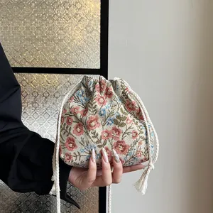 Floral canvas drawstring bucket bag with jacquard fabric and vintage embroidery