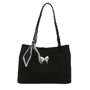 Large black French tote bag with white butterfly charm and decorative silk scarf accessory