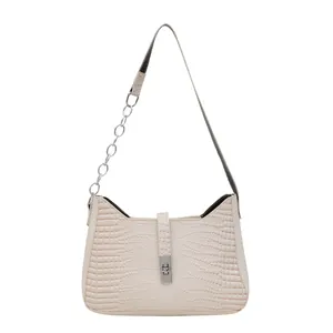 Chic beige crocodile-embossed underarm bag with silver buckle and chain strap