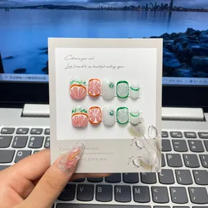 Uñas postizas artesanales con diseños 3D de frutas tropicales de pomelo y lima