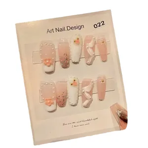 Pink gradient press-on nails with 3D cherry blossoms, pearls and glitter sequins