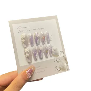Handmade amethyst purple press-on nails with 3D floral carvings and pearl accents