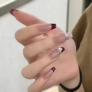 Sparkling French press-on nails in burgundy with 3D pink heart and crystal details