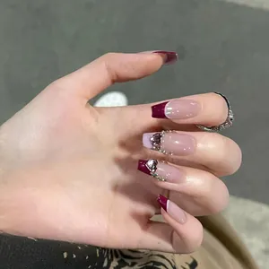 Sparkly French style burgundy and nude press-on nails with glitter and heart rhinestones