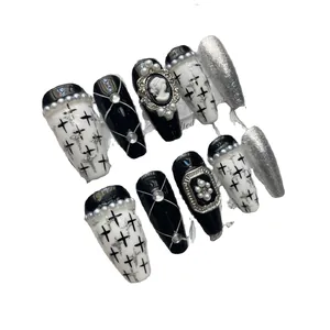 Handmade black and white coffin press-on nails with 3D gothic charms and silver accents