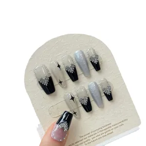 Dark punk style handmade press-on nails with silver hearts and glitter in black and grey