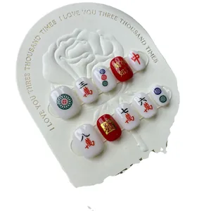 Handmade 3D mahjong press-on nails set in classic red and white with embossed characters