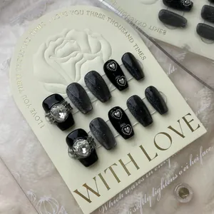 Handmade black cat eye press-on nails with silver glitter and heart crystal charms