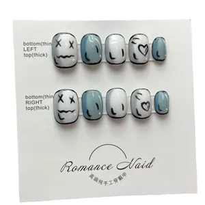 Handmade press-on nails set with minimalist 2D cartoon graffiti and heart patterns