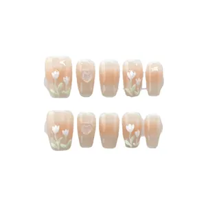 Handmade light pink gradient press-on nails with white tulip and 3D heart design