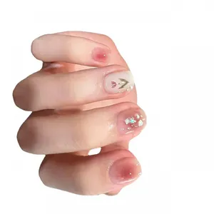 Pink gradient press-on nails featuring hand-painted tulips and pearl shell accents
