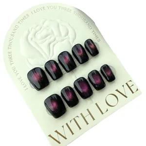 Handmade black and pink cat eye press-on nails with cosmic planet star design in square shape