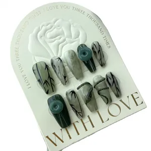 Handmade press-on nails featuring green jade marbling and bamboo ink art style