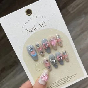 Handmade Mocha Candy press-on nails with 3D resin hearts, stars, and crystals art