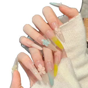 Long almond press-on nails with macaron gradients, 3D floral accents and pearls