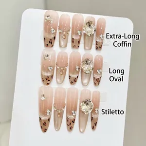 Handmade leopard print press-on nails with cat eye effect and luxury rhinestones