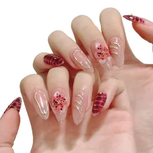 Unghie finte fatte a mano con fiori 3D, linee dorate e motivo leopardato bordeaux