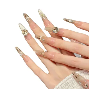 Handmade stiletto press-on nails with maple leopard print and champagne rhinestone accents