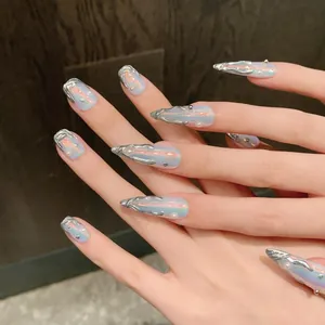 Macro shot of 3D fluid silver metal and pearls on aurora blue press-on nails