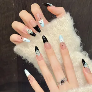 Detail of long almond press-on nails with blue gradient and 3D flower nail art decor