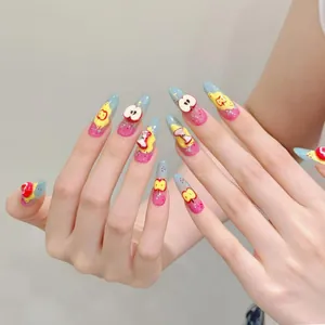 Detailed close-up of handmade press-on nails with 3D green apple and bear cartoon charms