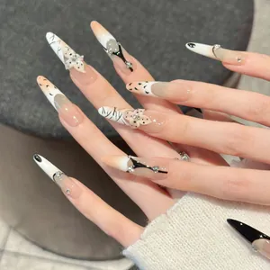 Extra-long stiletto press-on nails with leopard floral 3D carving and rhinestone accents