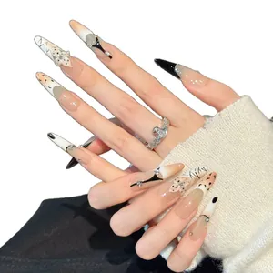 Handmade press-on nails with 3D flowers, leopard prints, and rhinestones on almond shape