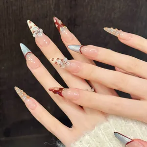 Unghie finte stiletto fatte a mano con fiori 3D e design glitterato effetto occhio di gatto