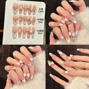 Handmade cat-eye press-on nails with 3D bows, pearls and crystals in three nail shapes