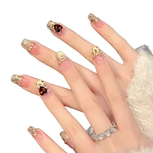 Sunset leopard print press-on nails with luxury heart rhinestones and glitter French tip