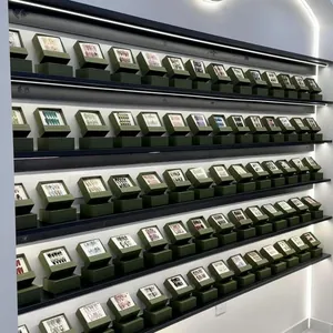 Detail view of premium dark green press-on nail display drawer boxes in rows