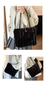 Detail of black faux fur tote bag with vertical stripes and cherry embroidery patch