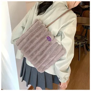 Detail of mauve faux fur tote bag showing striped texture and fashion girl patch