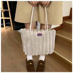 Detail of plush tote bag with vertical faux fur texture and Fashion Girl patch
