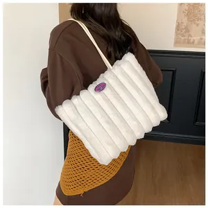 Detail of white plush tote bag with striped texture and fashion girl patch