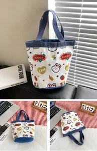 Blue canvas bucket tote bag with cute rabbit print and floral patterns in life scene