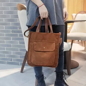 Brown corduroy tote bag with adjustable shoulder strap for casual daily commuting use