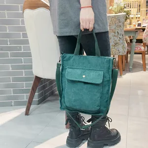 Japanese style dark green corduroy tote bag with adjustable strap and front button pocket
