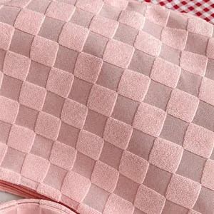 Detail view of pink waffle textured fabric showing the durable thickened material