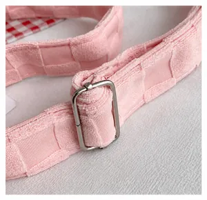 Detail of pink waffle fabric shoulder strap with silver adjustable metal buckle