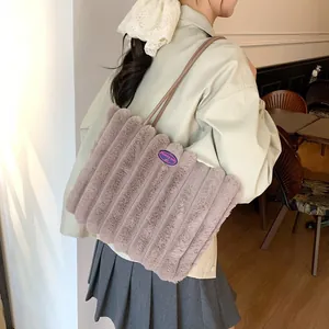 Furry plush tote bag with purple fashion patch and thin shoulder straps in daily use
