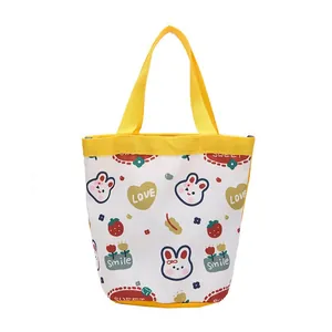 Cute cartoon canvas bucket bag with rabbit prints and yellow handles for casual shopping